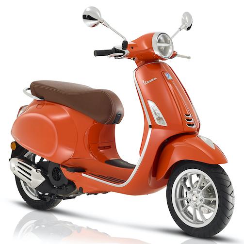 Vespa Primavera 125 orange, 3 quart face droite